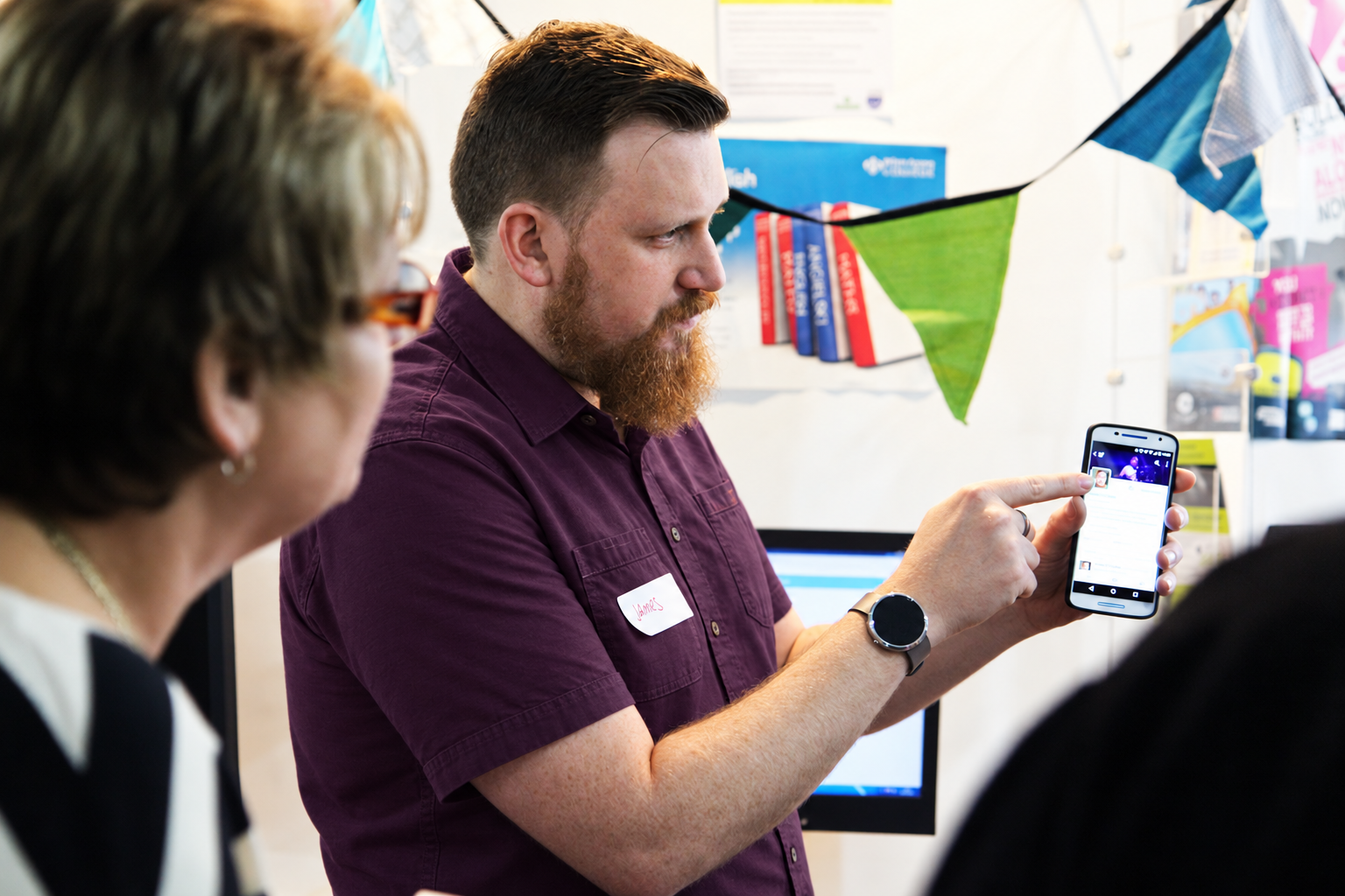 James demonstrating a smartphone during a digital skills session